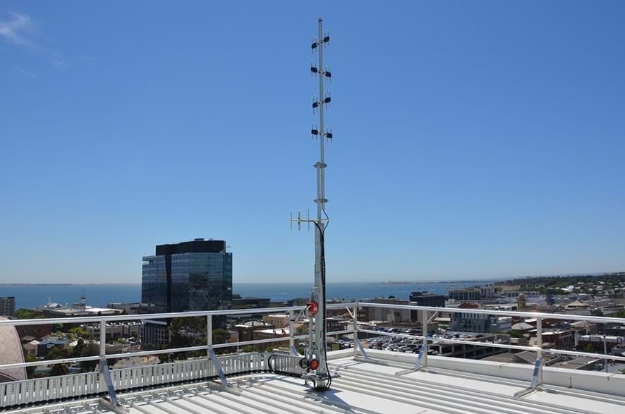 Long range antennas lowerable tilt pole
